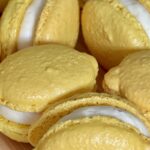 Lemon shaped Macarons filled with thick Lemon Curd macaron filling and lemon white chocolate ganache