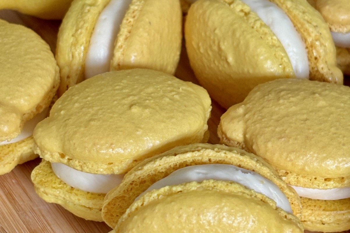 Lemon shaped Macarons filled with thick Lemon Curd macaron filling and lemon white chocolate ganache