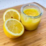 Quick and Easy Lemon Curd Cake Filling in Jar with cut fresh lemon