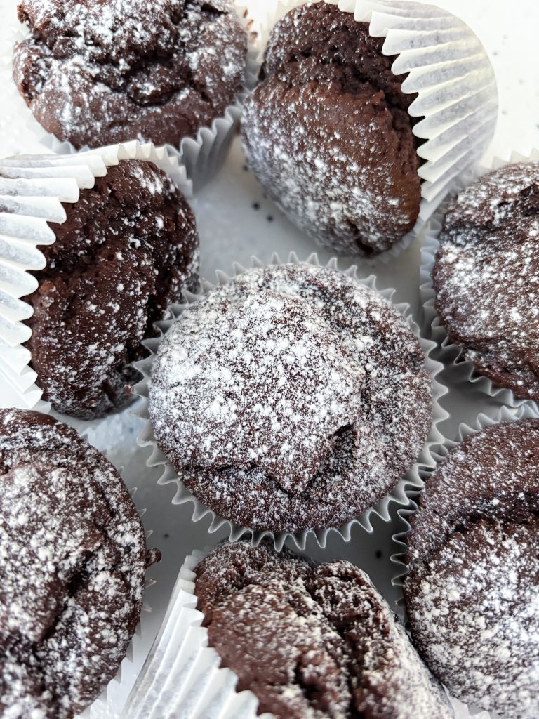Olive Oil Chocolate Muffins dusted in powdered sugar