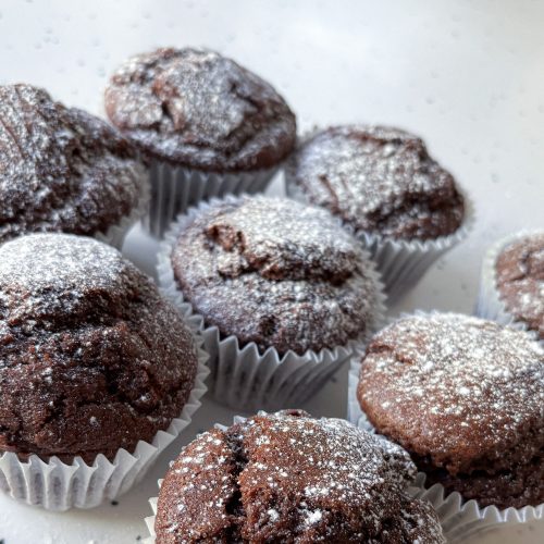 Olive Oil Chocolate Muffins dusted with powdered sugar