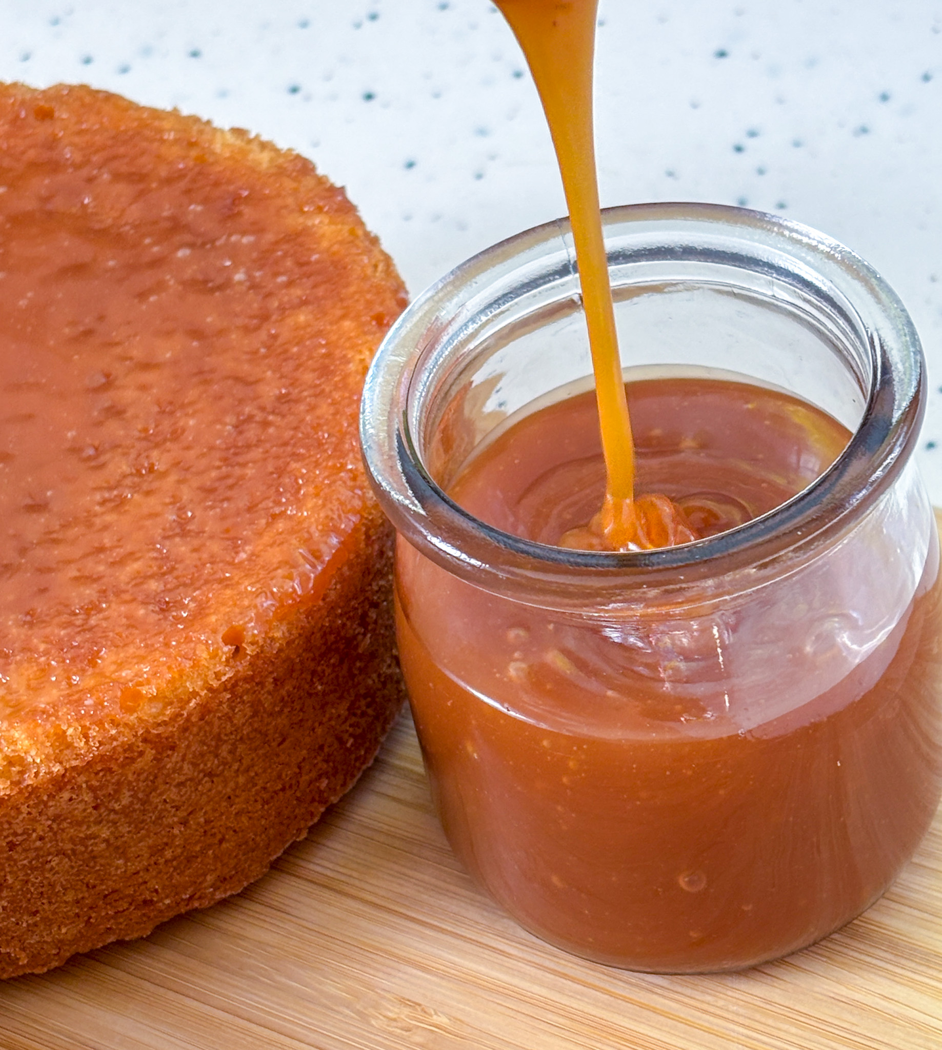 Salted Caramel pouring into jar and salted caramel on sponge cake layer