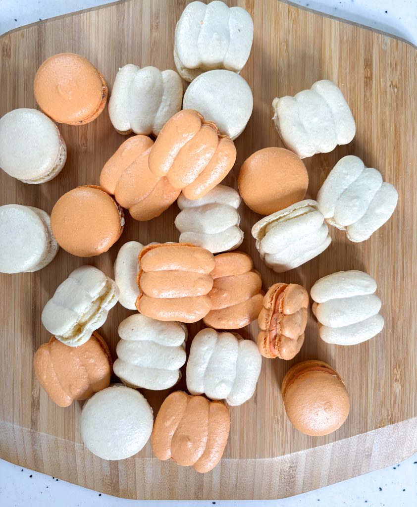 Rustic style pumpkin shaped macarons orange and white
