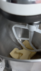 Butter in kitchen aid mixing bowl. Beat butter step of recipe before image
