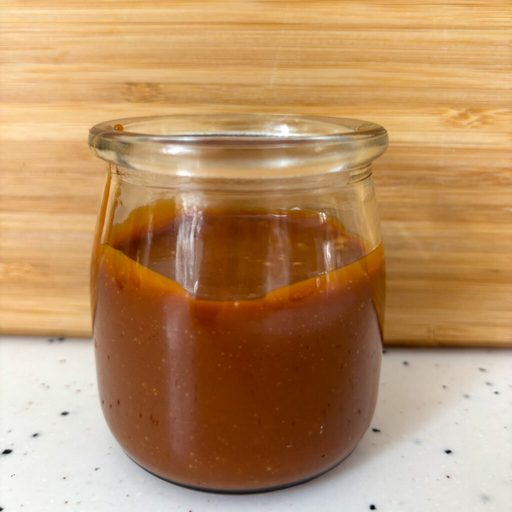 Thick caramel in small jar
