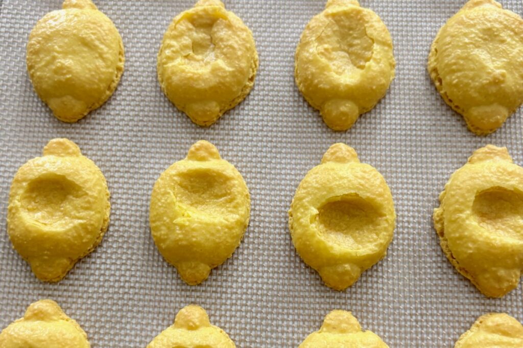 Oily, Soft, Wrinkled macaron shells on oven tray from oily macaron troubleshooting post