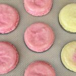 Oily wrinkled soft macaron shells caused by oily almond flour from oily macaron troubleshooting blog post