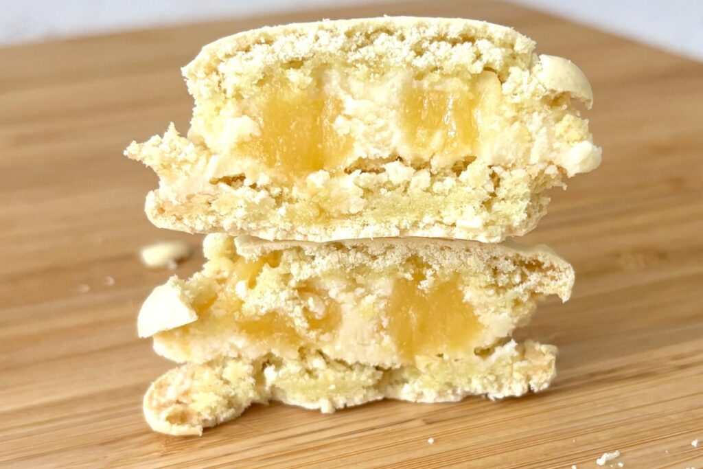 Finished lemon macarons cross section showing two fillings
