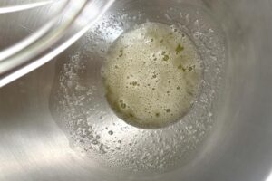Lemon Macarons process step heated swiss meringue ready to be whisked
