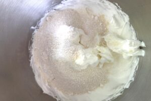 Lemon Macarons process step showing meringue with dry ingredients added
