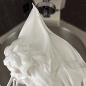 Swiss meringue whipped to stiff peaks showing meringue texture and shape