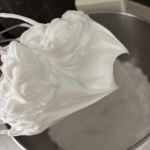 Swiss meringue whipped to stiff peaks showing meringue texture and shape